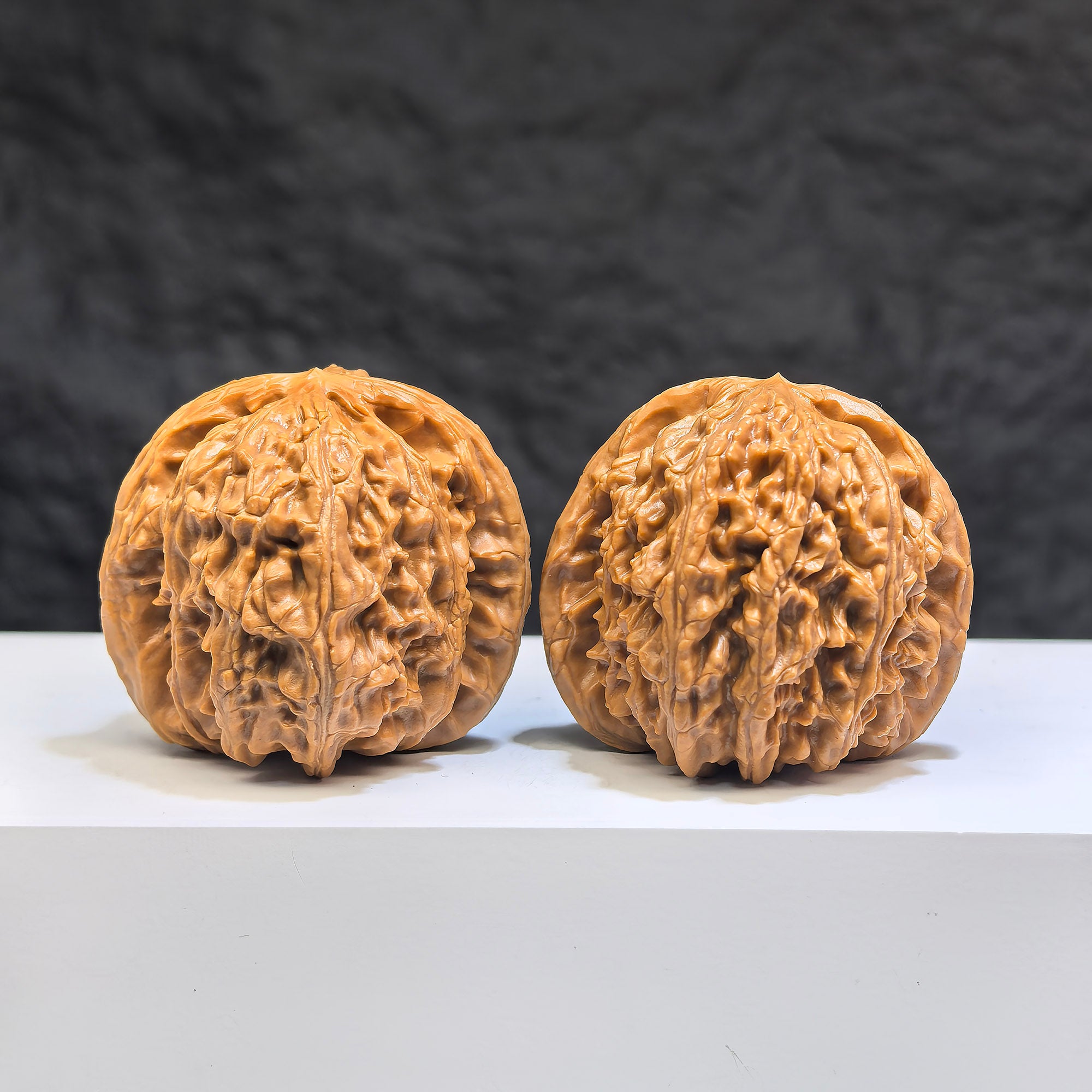 Pair of White Lion Wenwan Walnuts from Wenwan Art, 39mm size, detailed white lion carvings on polished walnut surfaces.