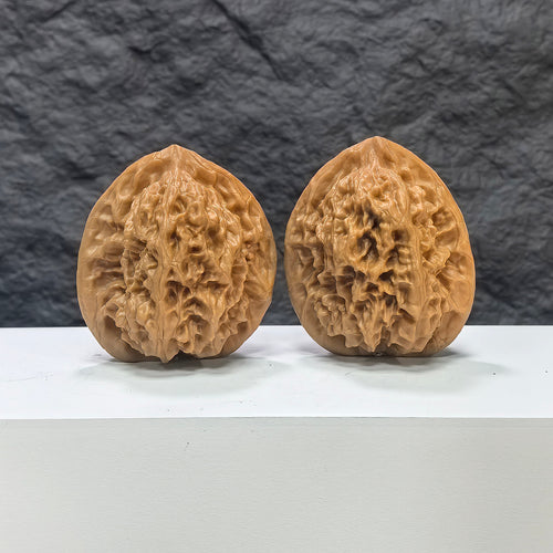 Pair of Arhat Head Wenwan walnuts by Wenwan Art, round profile, 41mm x 38mm, showing detailed natural walnut texture and craftsmanship.