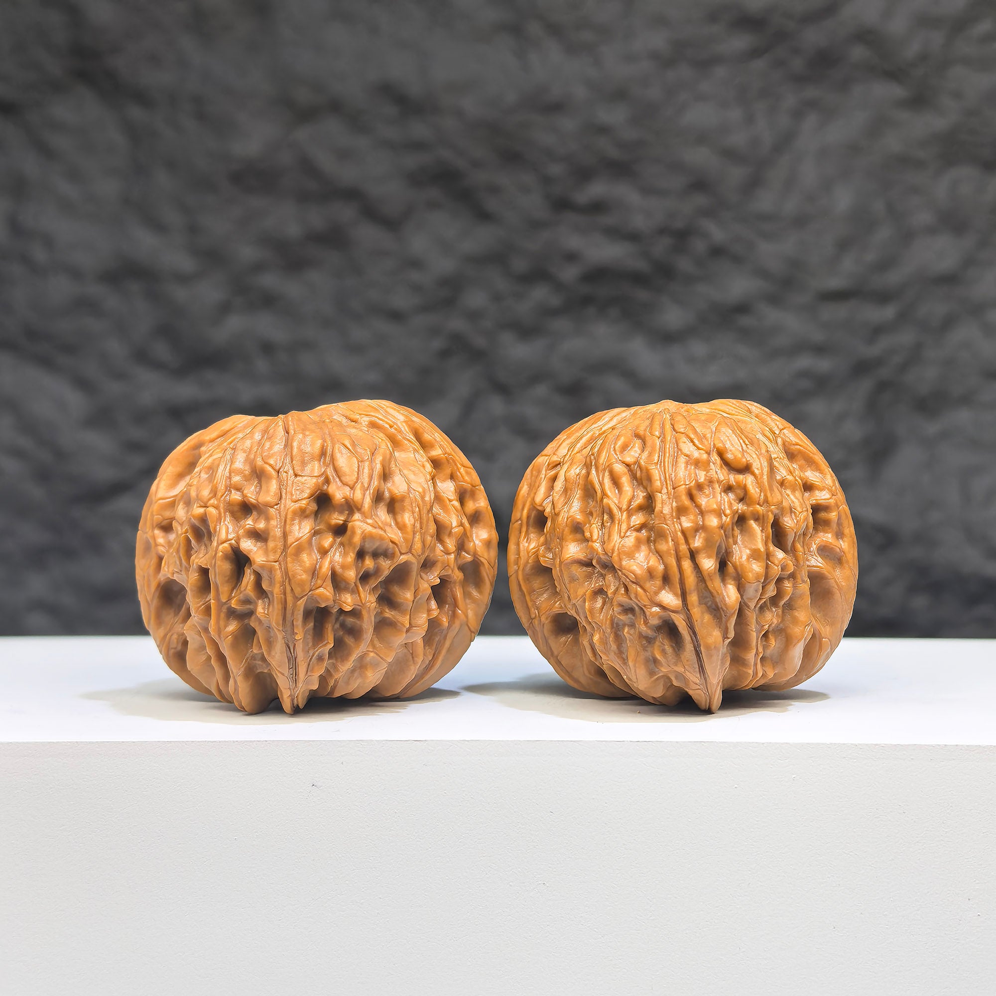 Pair of red shell Wenwan walnuts from Wenwan Art, featuring classic millstone design, 42mm x 38mm size, traditional craftsmanship.