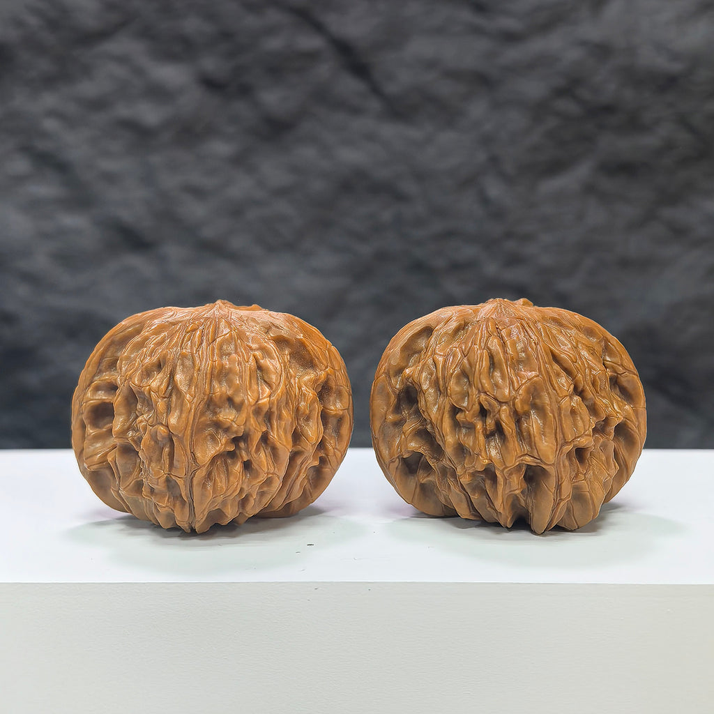 Pair of Classic Scholar Wenwan Walnuts by Wenwan Art, hand-matched with 41mm and 39mm sizes, featuring smooth polished surfaces.