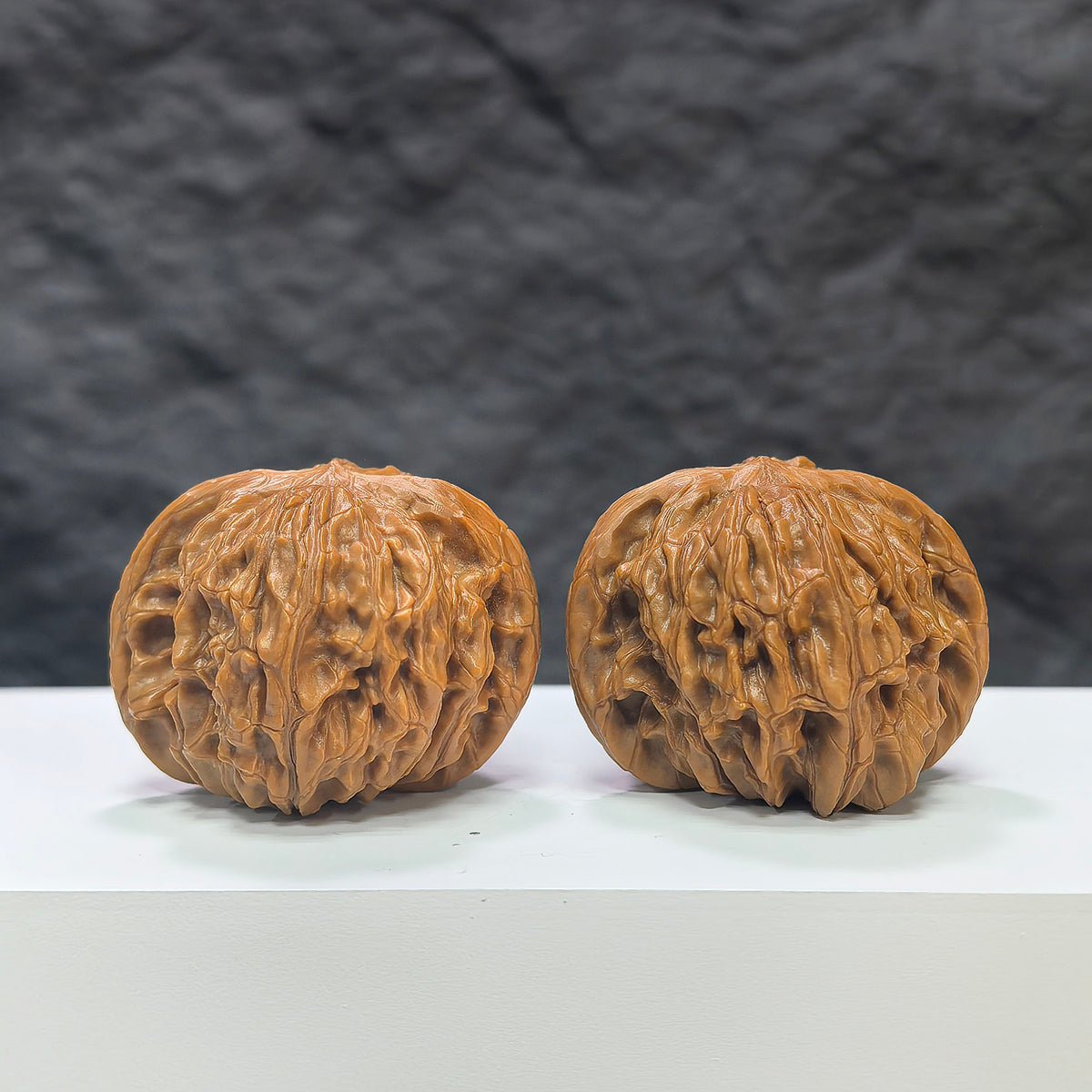Pair of Classic Scholar Wenwan Walnuts by Wenwan Art, hand-matched with 41mm and 39mm sizes, featuring smooth polished surfaces.