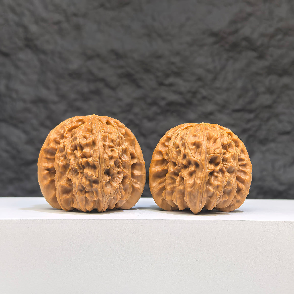 Pair of spherical white lion Wenwan walnuts from Wenwan Art, 41mm diameter, round profile with intricate white lion design.