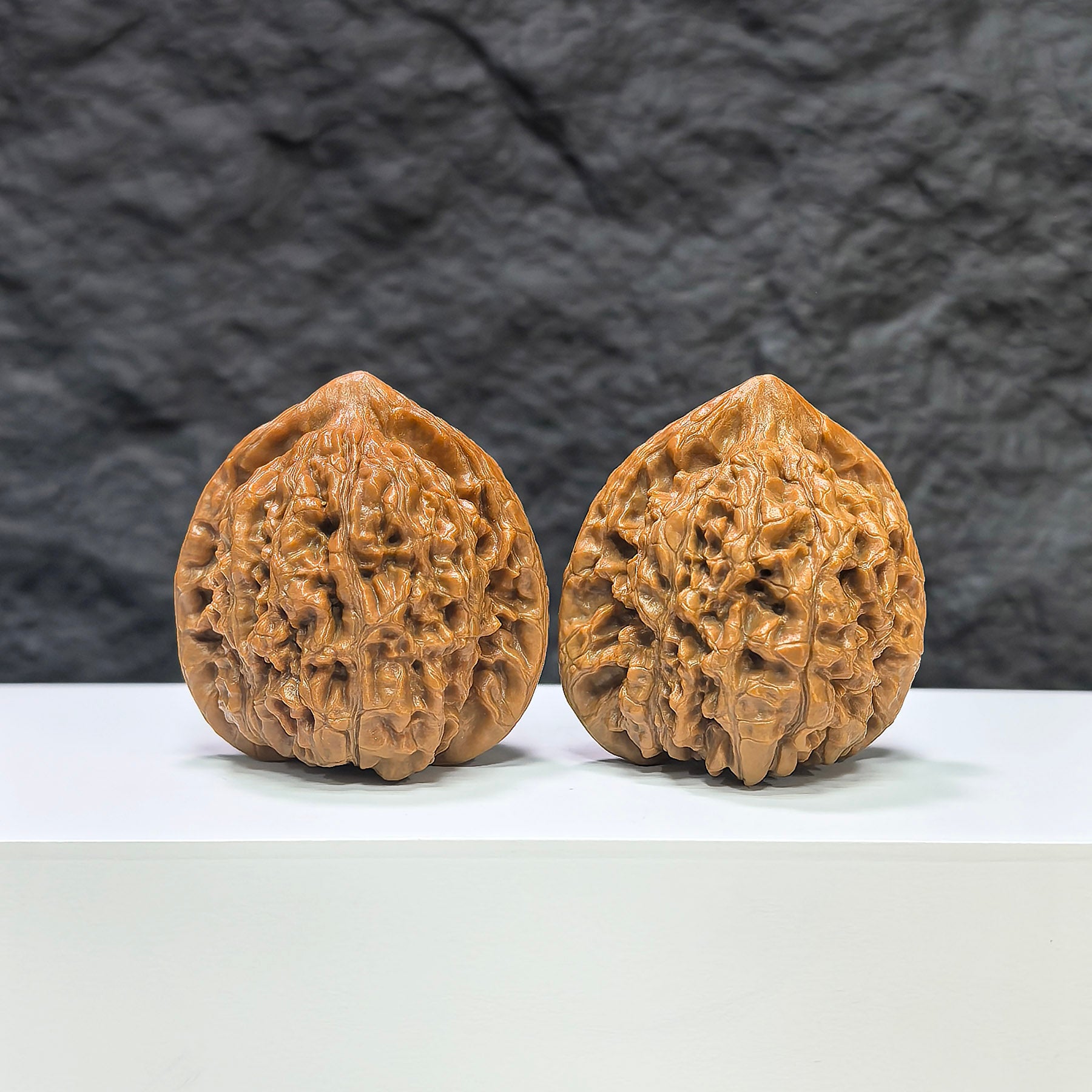 Pair of Kylin Texture Wenwan Walnuts by Wenwan Art, featuring intricate 麒麟紋 pattern, measuring 40mm x 37mm.