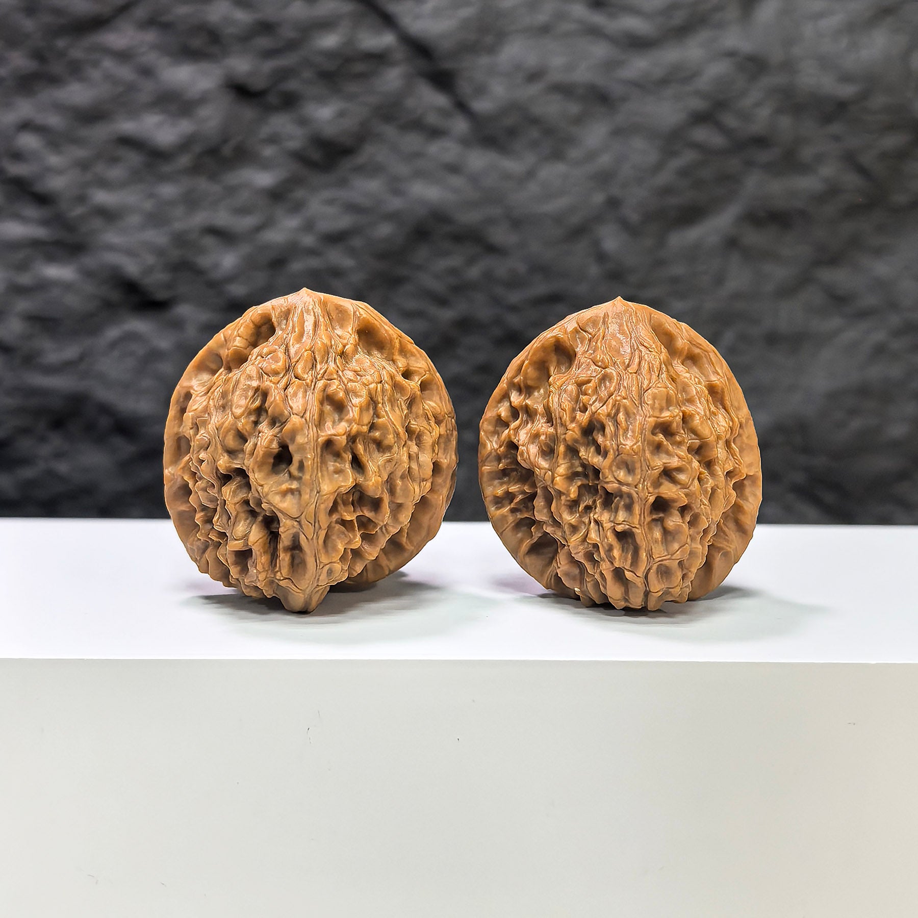 Pair of Golden Kylin Wenwan walnuts from Wenwan Art, 37mm, featuring intricate carvings and a smooth, polished surface.