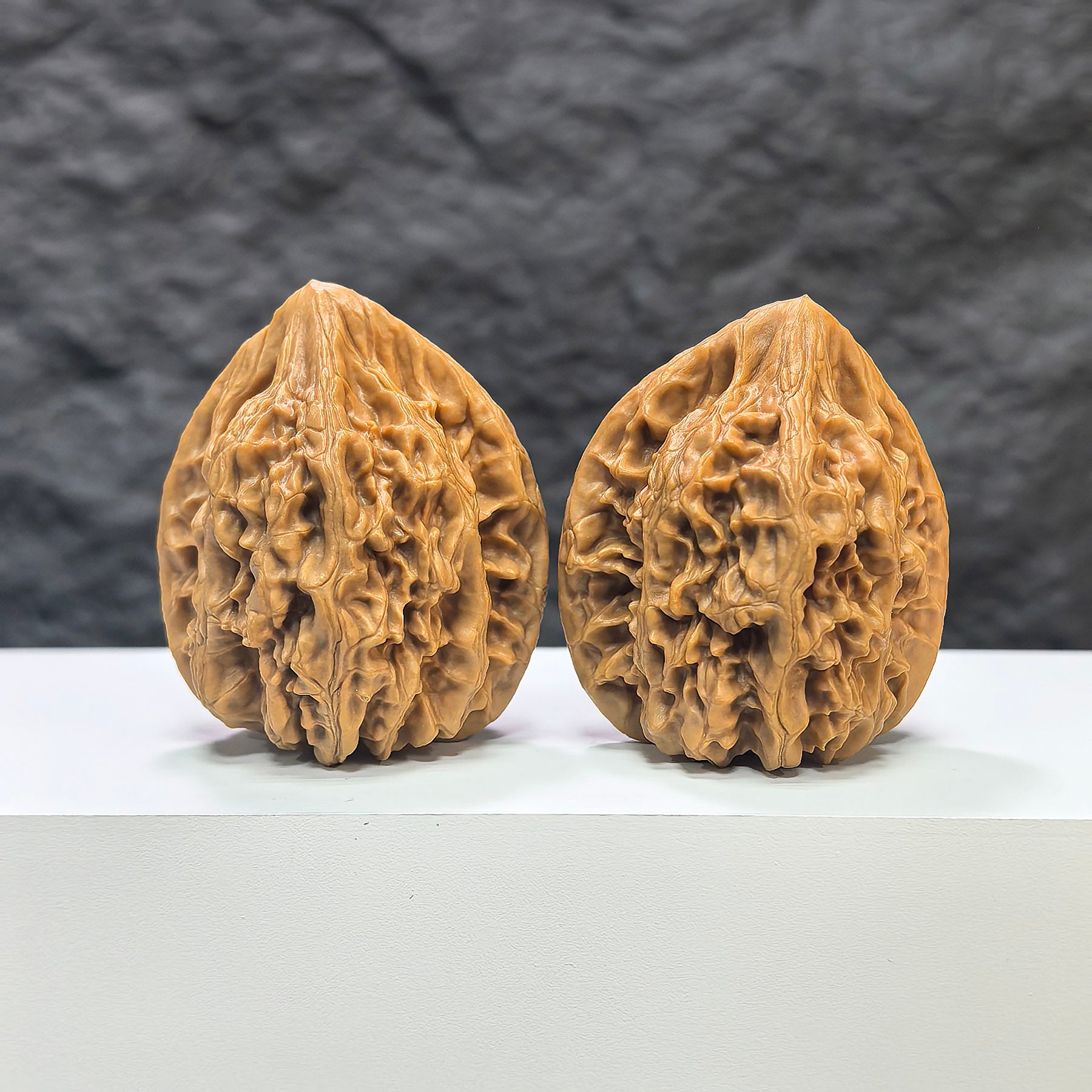 Pair of Beijing Chicken Heart Wenwan walnuts from Wenwan Art, 41mm x 40mm, featuring smooth, polished walnut carvings.