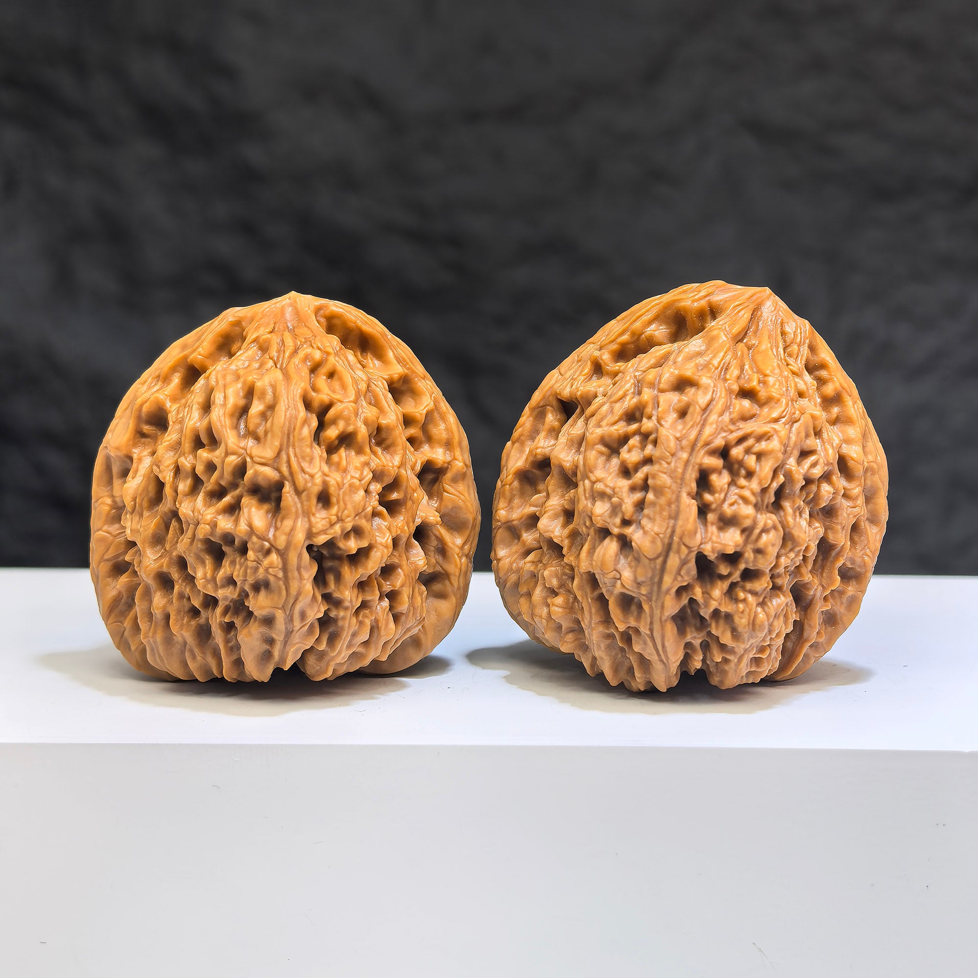 Pair of Nanjiangstone Wenwan walnuts from Wenwan Art, 40mm, showcasing smooth, polished walnut-shaped stones with natural patterns.