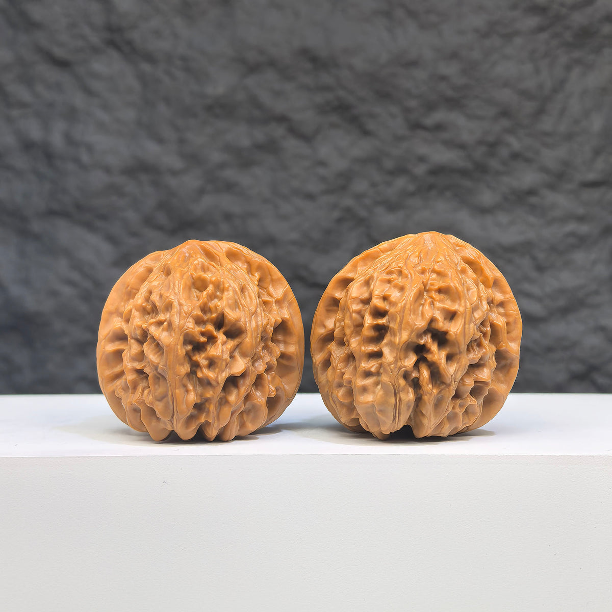 Selected grade Wild Bison Walnut Wenwan art piece, 3.8×3.7cm, featuring smooth, polished walnut with natural grain details.