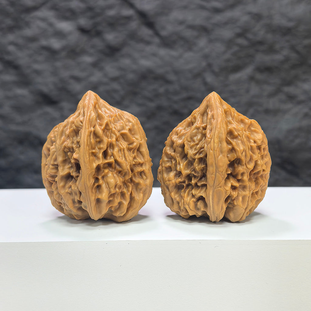 Pair of Beijing Chicken Heart Wenwan walnuts from Wenwan Art, showing smooth, rounded walnut pairs with natural texture and size details.