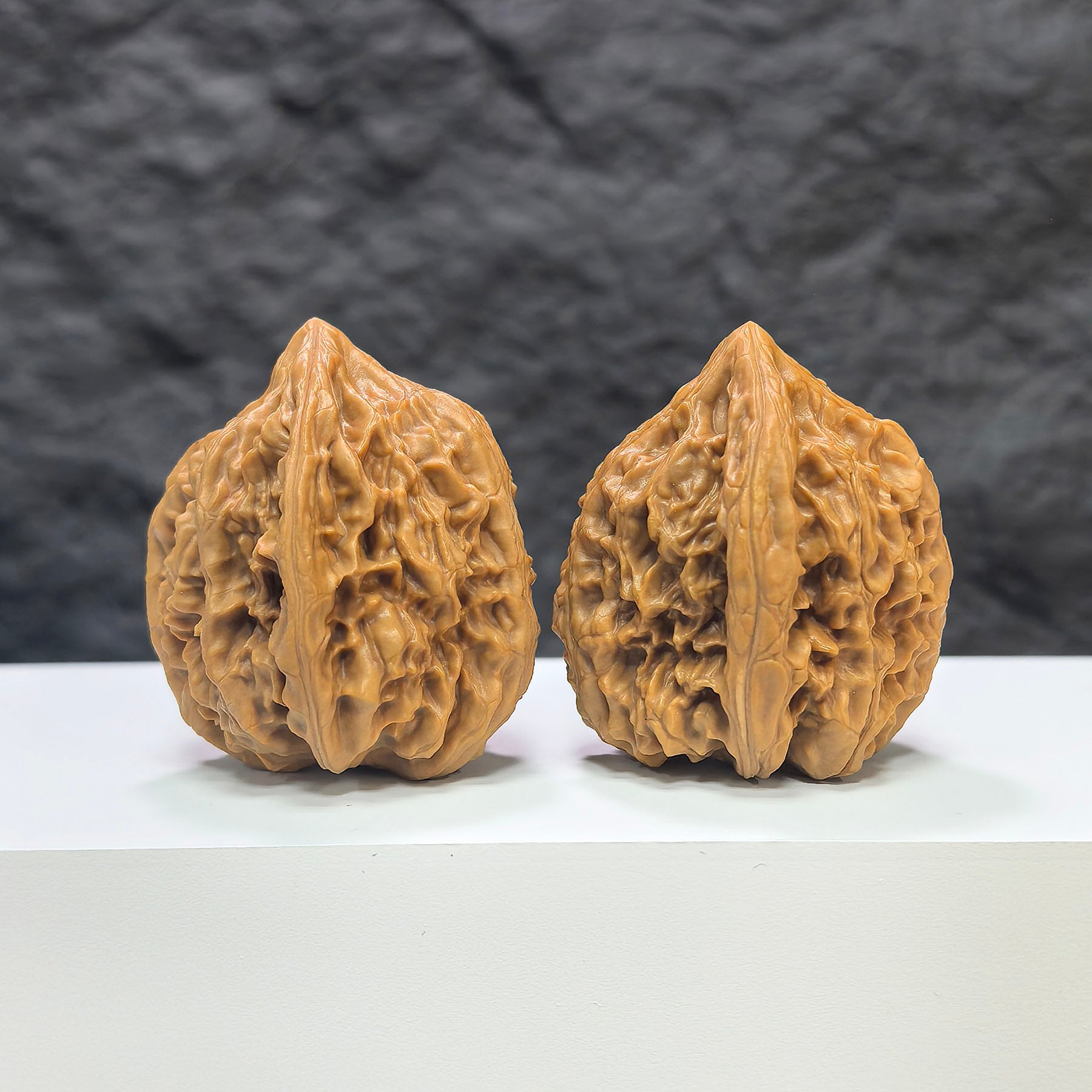Pair of Beijing Chicken Heart Wenwan walnuts from Wenwan Art, showing smooth, rounded walnut pairs with natural texture and size details.