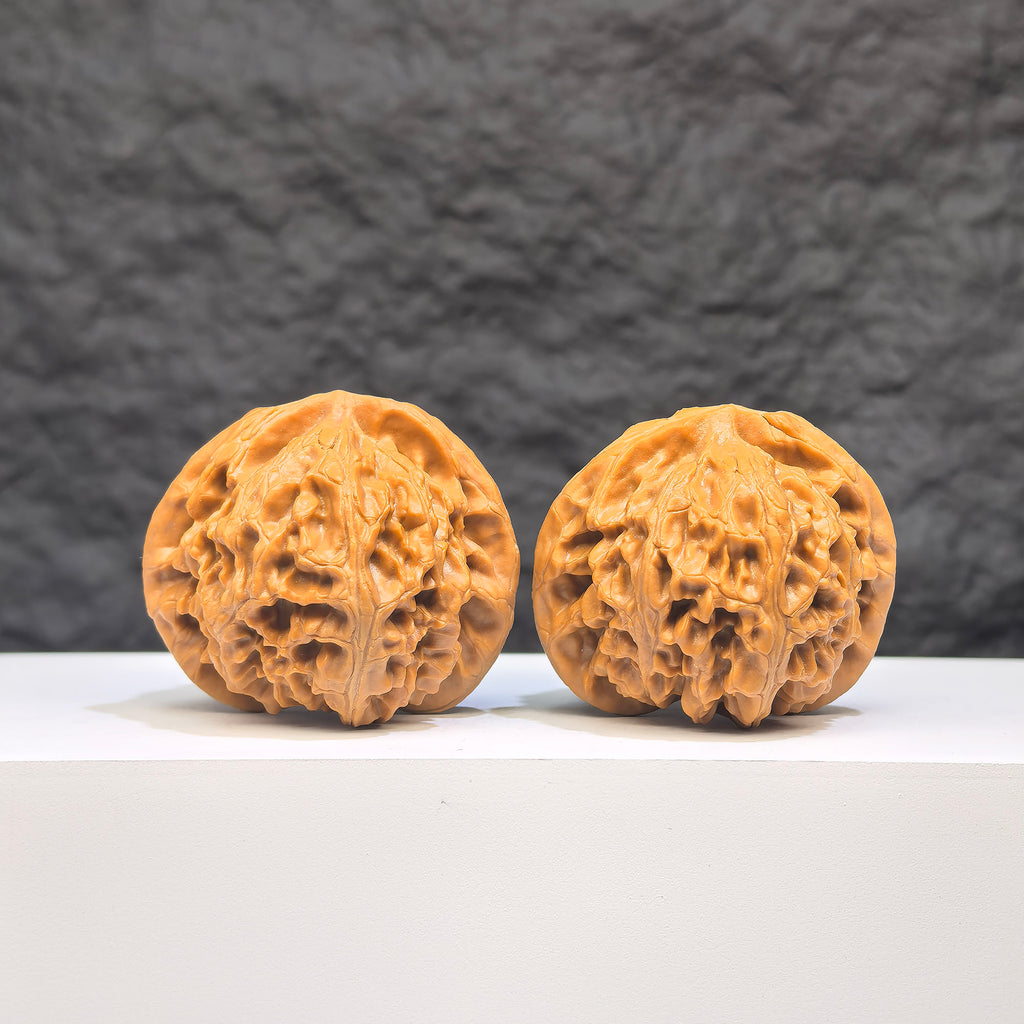 Pair of Palace Lantern Wenwan walnuts from Wenwan Art, 42mm x 40mm, featuring intricate carvings and traditional design.
