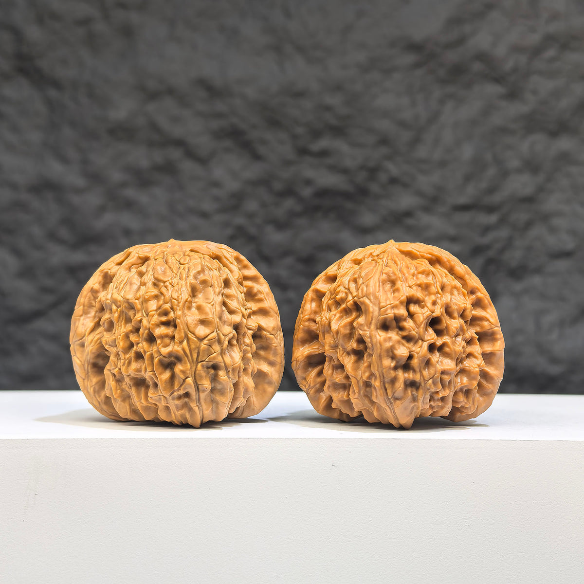 Pair of White Lion Wenwan Walnuts from Wenwan Art, featuring detailed carved white lion designs, 37-38mm size.