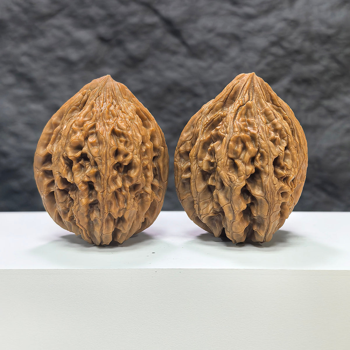 Pair of Classic Scholar Wenwan Walnuts by Wenwan Art, hand-matched, large 42-43mm walnuts with detailed natural wood grain.