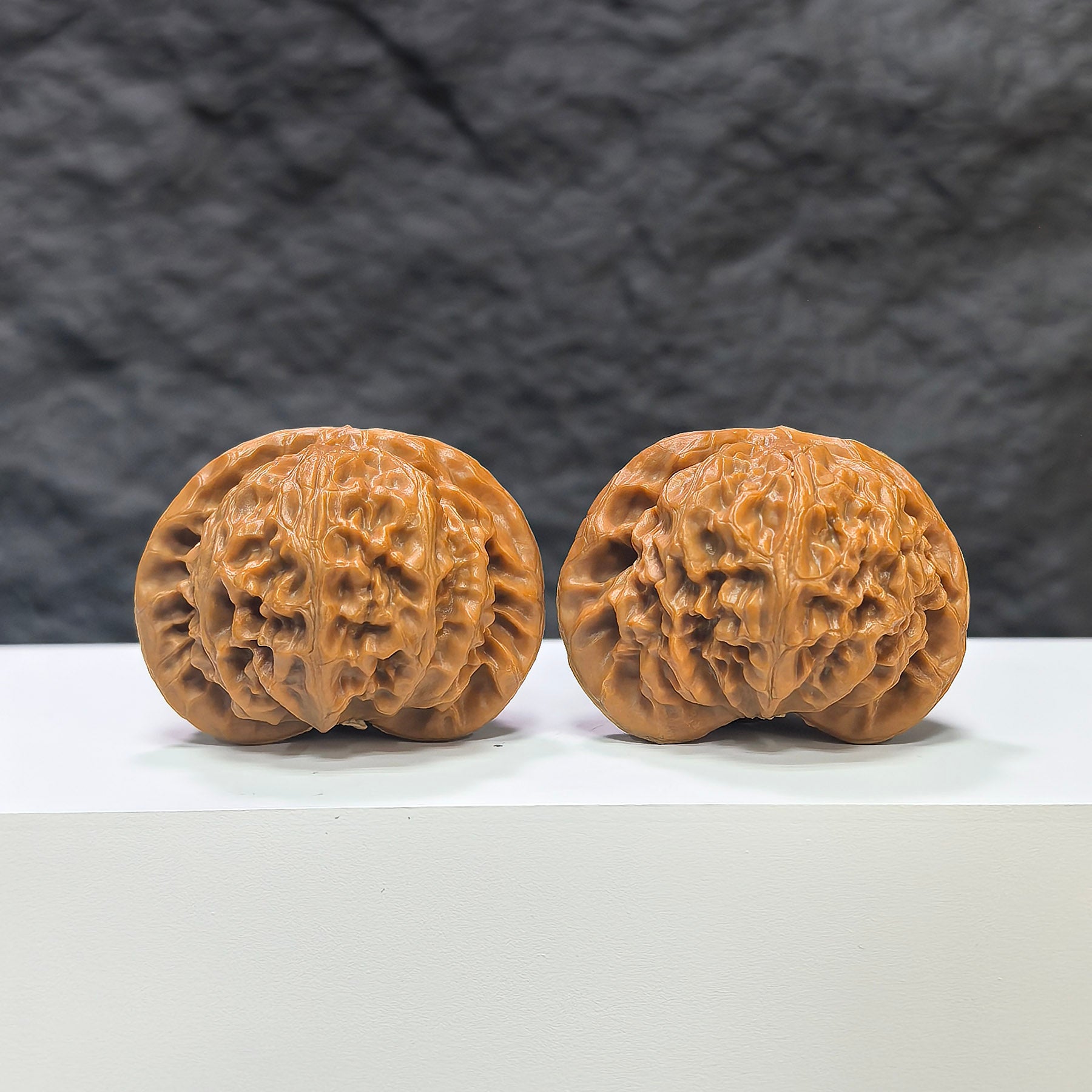 Pair of Classic Scholar Wenwan Walnuts by Wenwan Art, hand-matched with 43mm x 38mm size, showcasing detailed natural walnut texture.