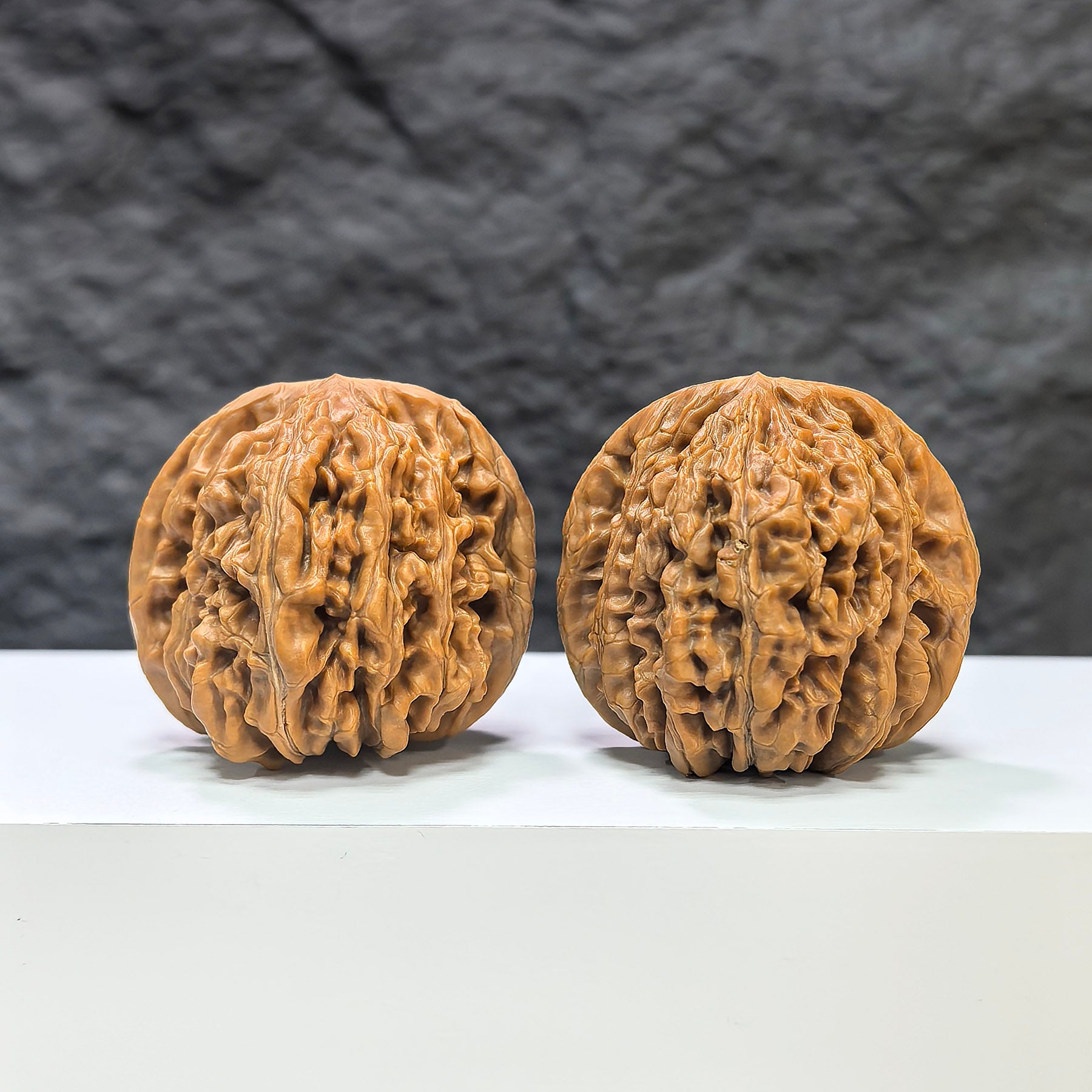 Pair of Sizuolou Wenwan Walnuts by Wenwan Art, 42mm size, showcasing detailed carved walnut art with natural wood grain.