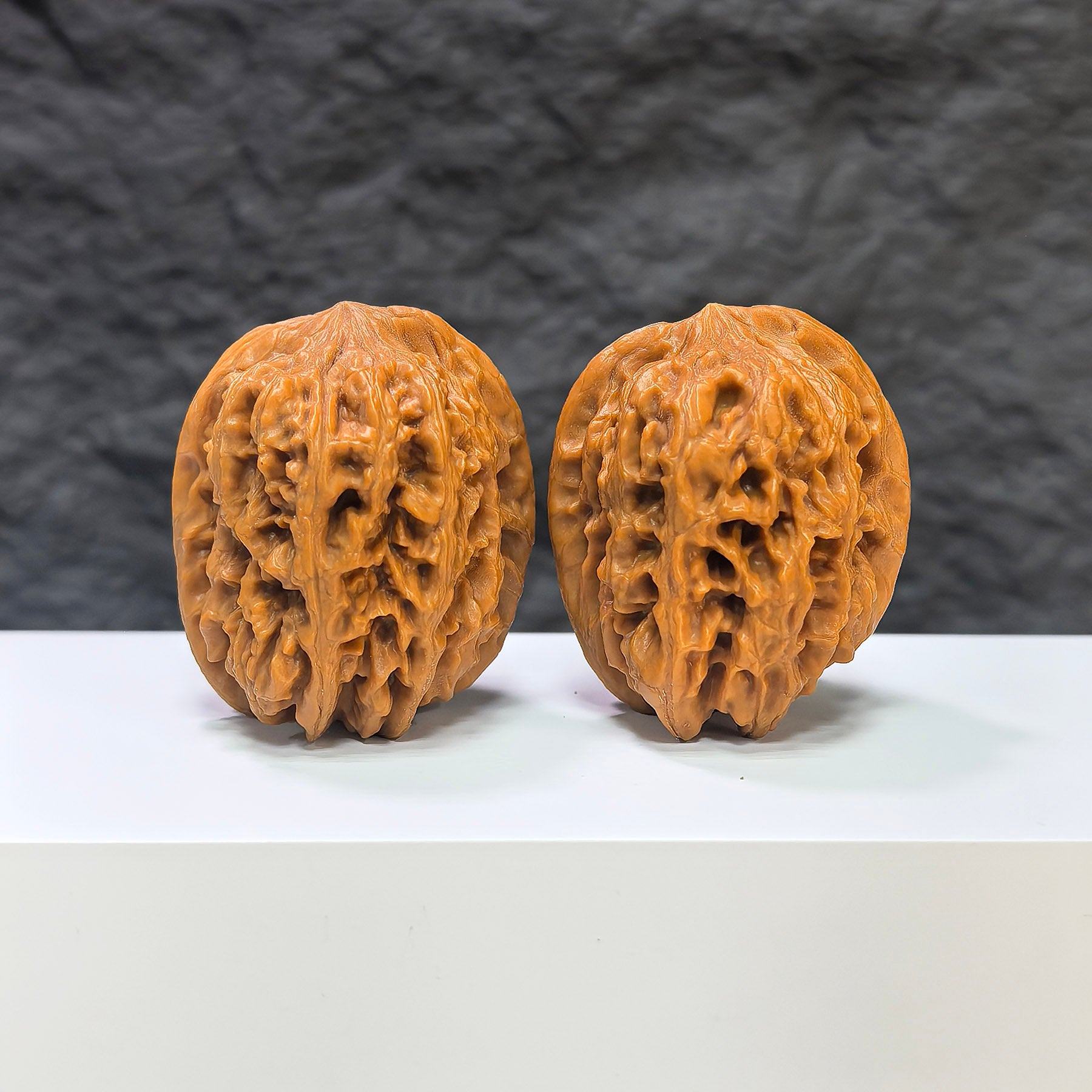 Pair of Pinggu Golden Hammer Wenwan walnuts from Wenwan Art, 39mm x 41mm, featuring smooth, polished walnut surfaces.