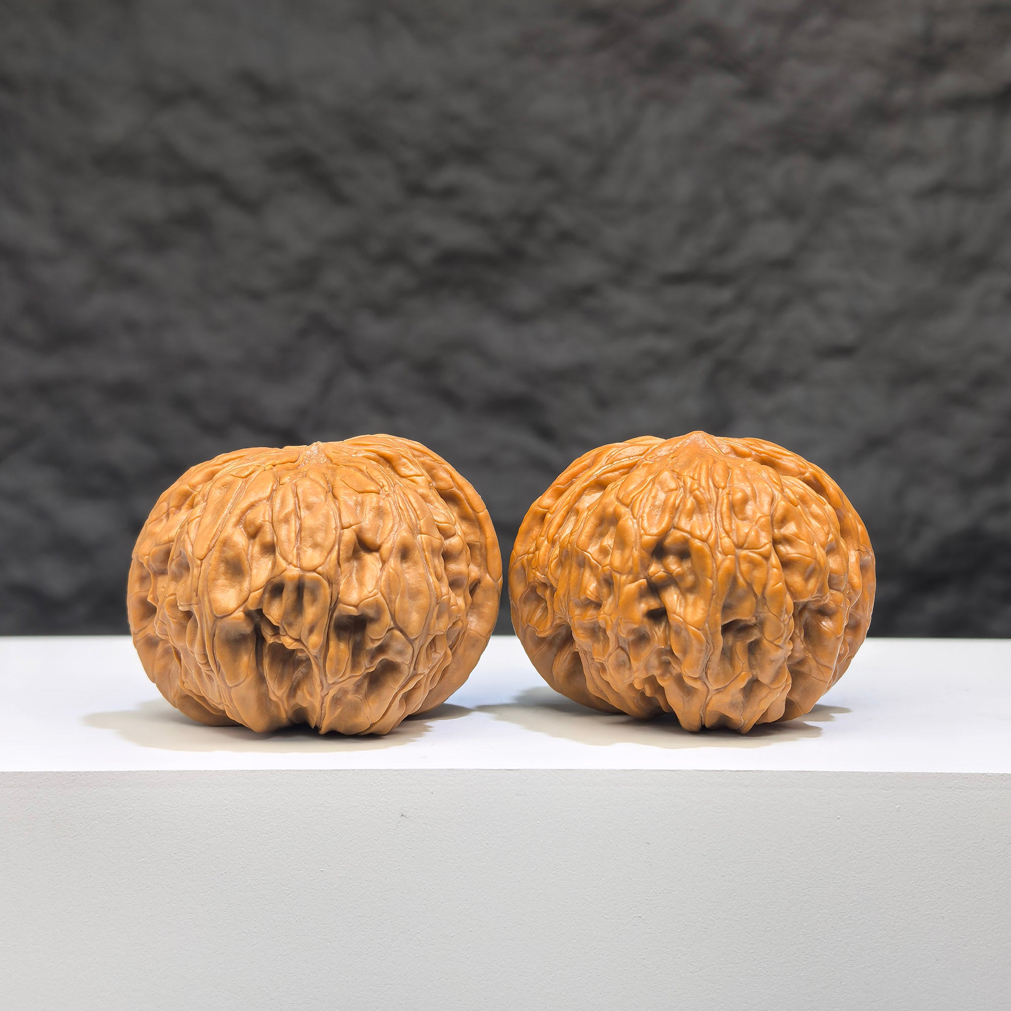 Pair of Wild Millstone Wenwan walnuts from Wenwan Art, authentic wild walnuts measuring 39mm by 37mm, natural and textured.