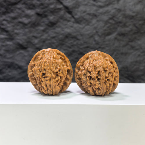 Pair of Golden Kylin Wenwan walnuts by Wenwan Art, 36mm, featuring intricate carvings and a rich golden finish.