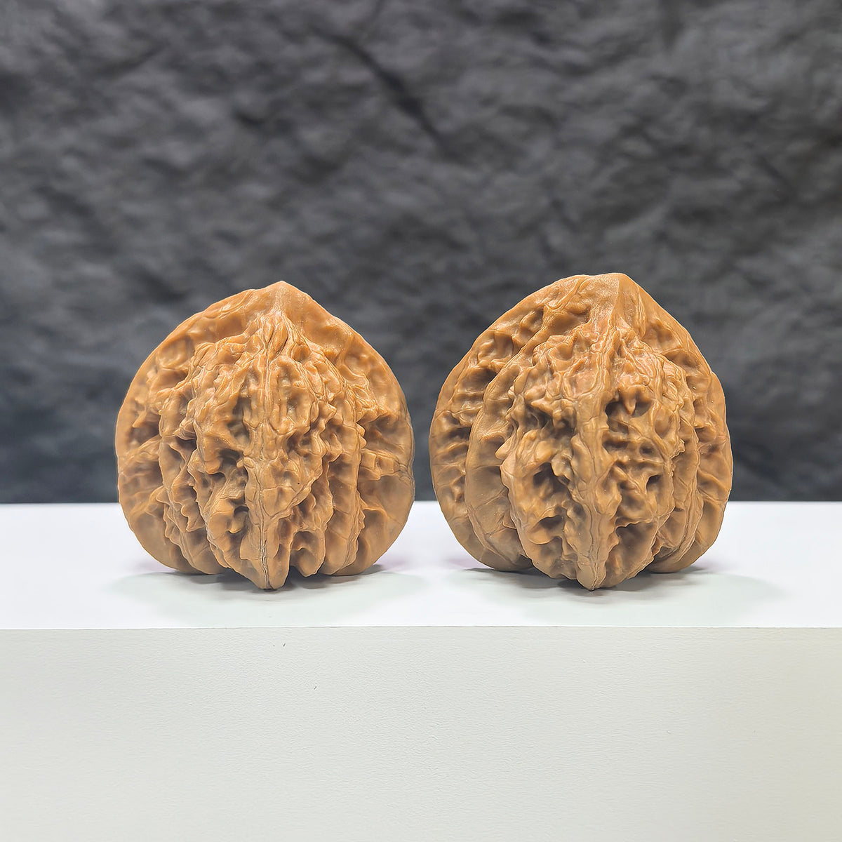 Pair of Xiayunling Classic Wenwan Walnuts from Wenwan Art, 43mm x 41mm, showing detailed natural walnut surfaces.