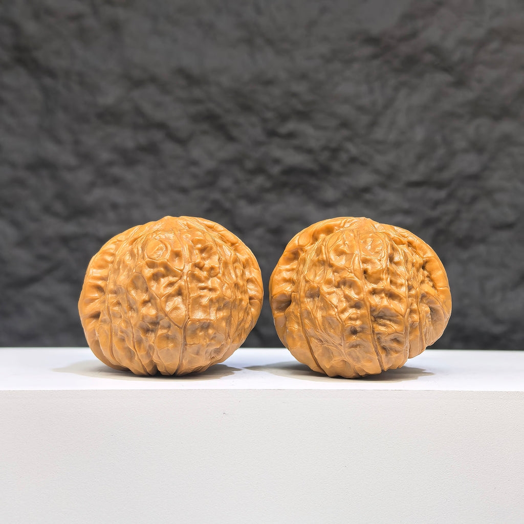 Pair of small Wenwan Walnut miniatures with pumpkin-shaped carvings, crafted by Wenwan Art, measuring approximately 38mm by 40mm.