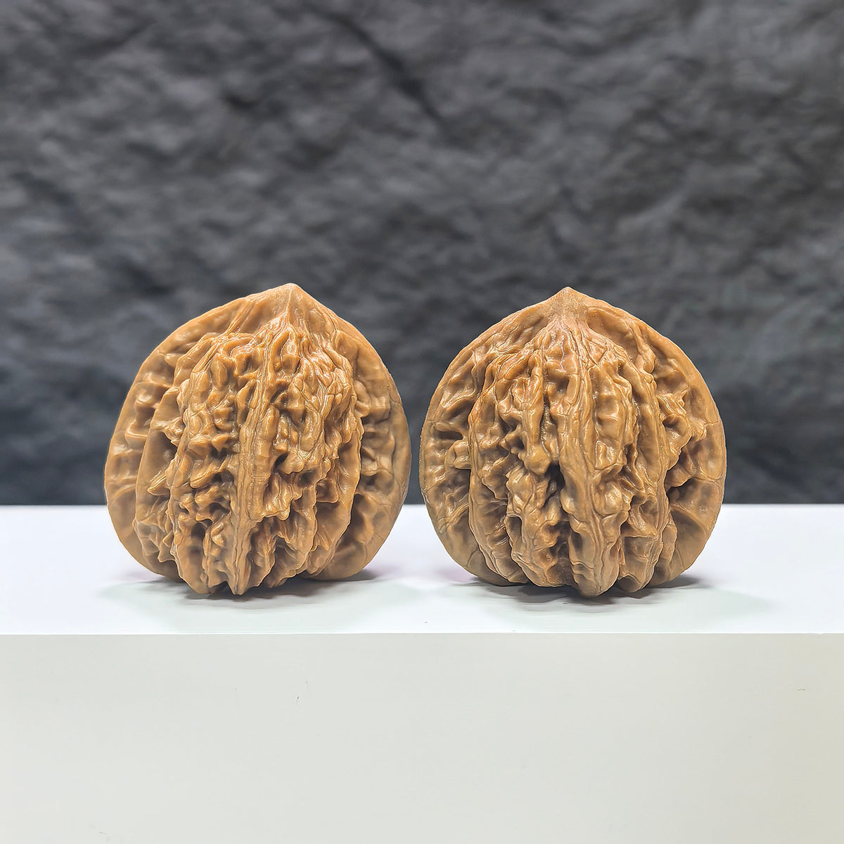 Pair of Peach Heart Xiayunling Wenwan walnuts from Wenwan Art, 41mm x 39mm, featuring smooth, natural walnut surfaces with peach heart shape.