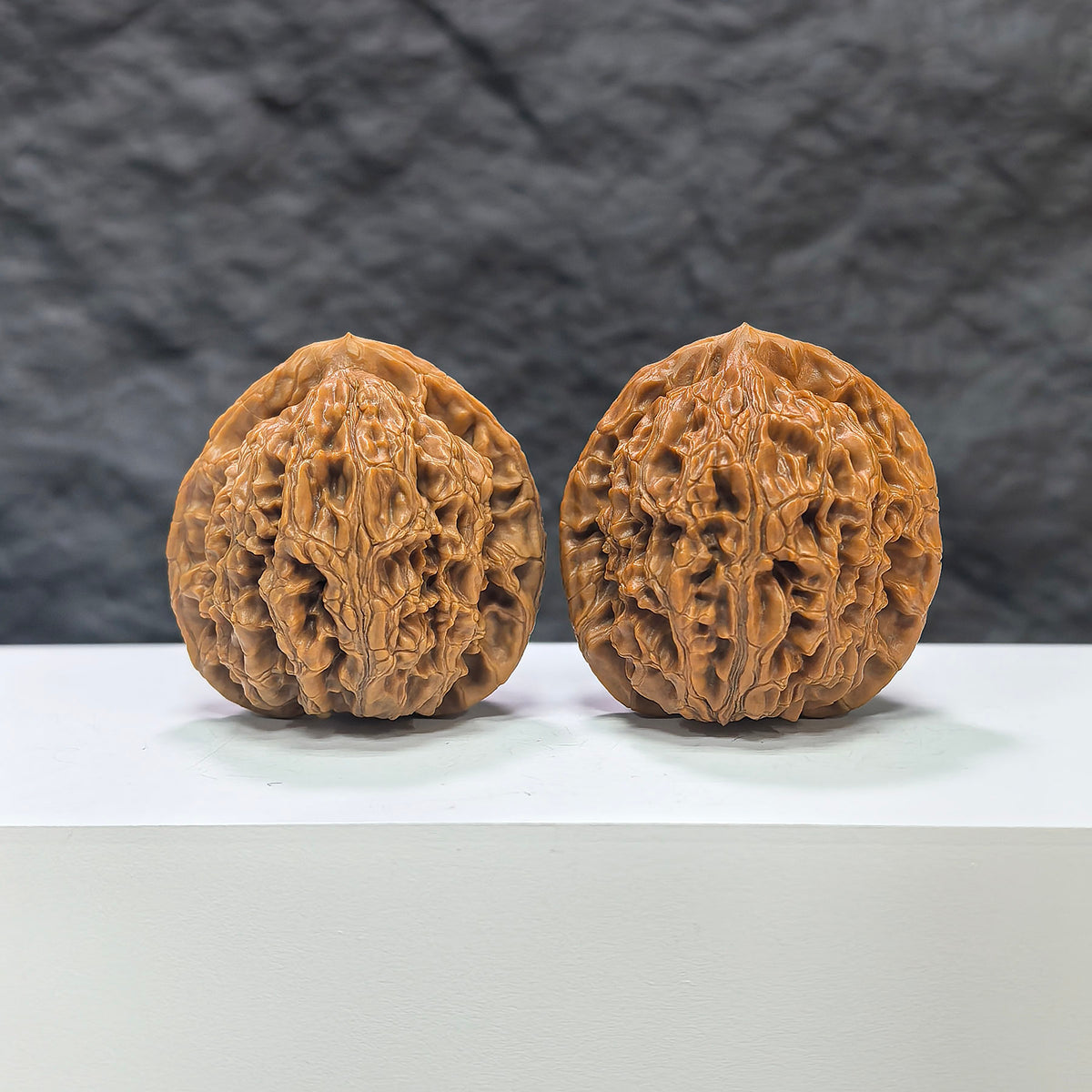 Pair of Water Dragon Texture Wenwan Walnuts by Wenwan Art, 40mm x 39mm, showcasing intricate carved water dragon patterns.
