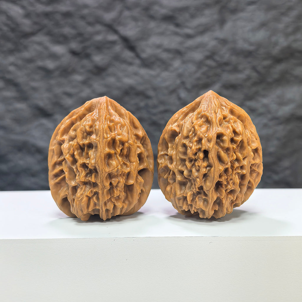 Pair of Beijing Chicken Heart Wenwan walnuts from Wenwan Art, 41mm x 40mm, showcasing intricate natural walnut patterns.