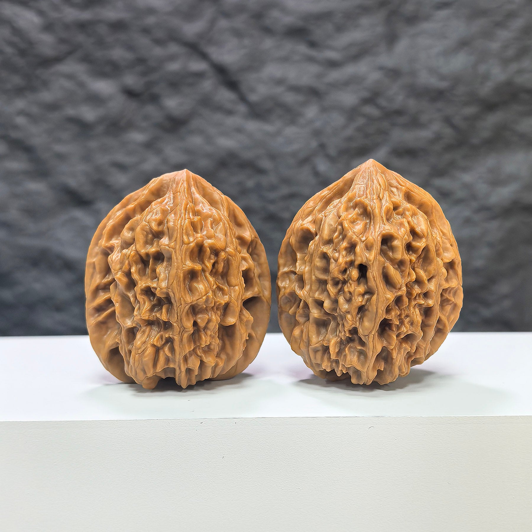 Pair of Beijing Chicken Heart Wenwan walnuts from Wenwan Art, 41mm x 40mm, showcasing intricate natural walnut patterns.