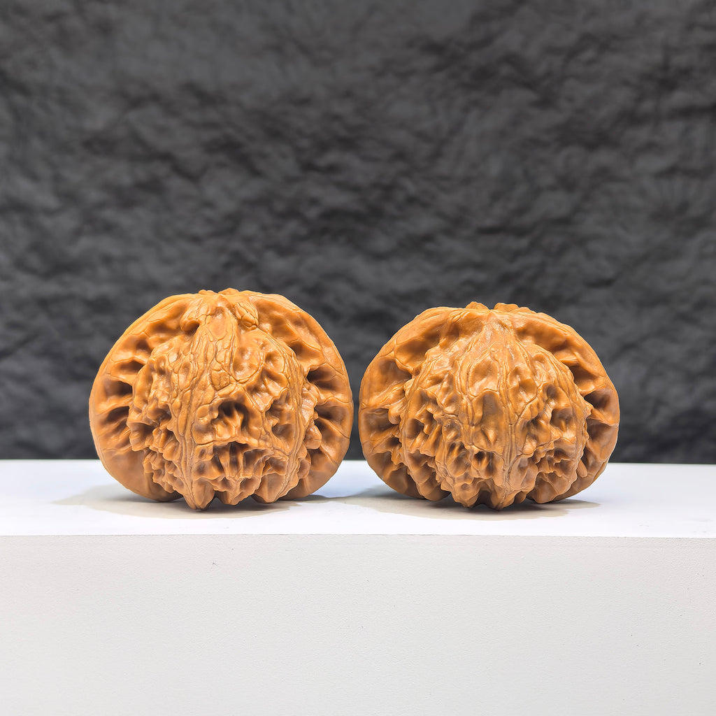 Pair of Palace Lantern Wenwan walnuts from Wenwan Art, featuring intricate carvings and natural wood grain details, 44mm x 38mm size.