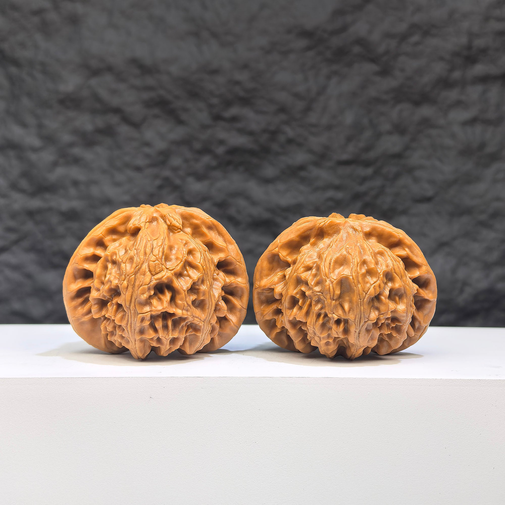 Pair of Palace Lantern Wenwan walnuts from Wenwan Art, featuring intricate carvings and natural wood grain details, 44mm x 38mm size.