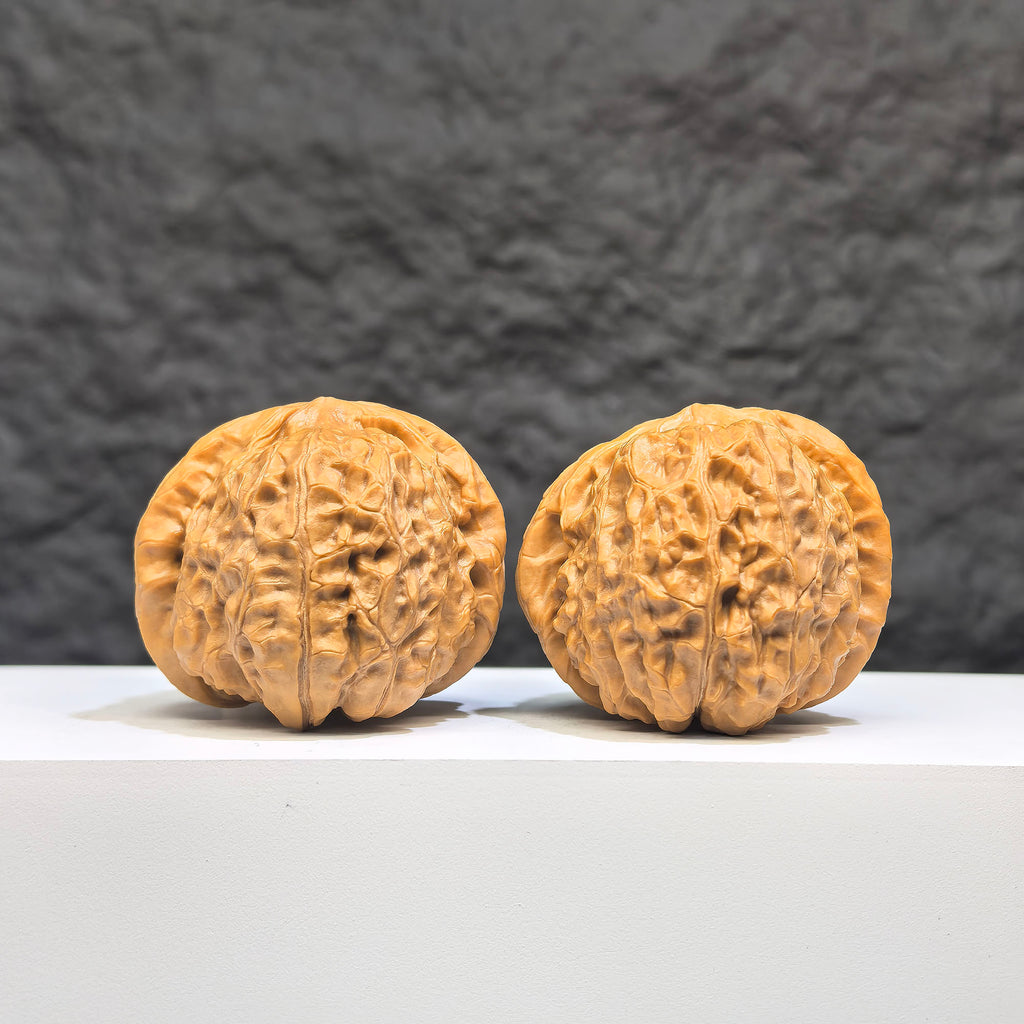 Pair of Pumpkin Pier Wenwan Walnuts by Wenwan Art, 41mm x 44mm, featuring detailed carved pumpkin design.