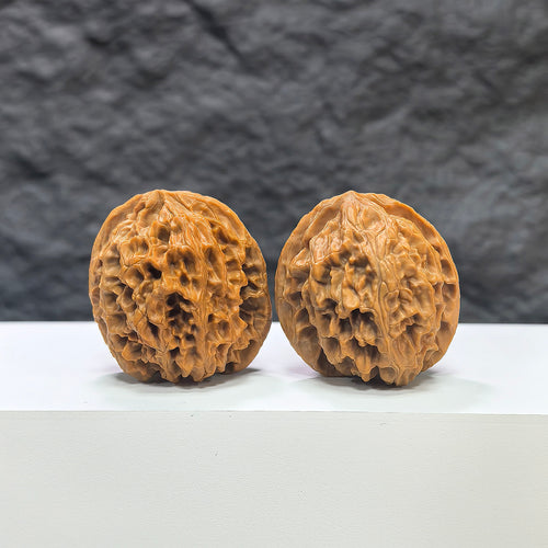 Pair of "Apple Garden" Wenwan Walnuts by Wenwan Art, 36mm, featuring detailed carved walnut surfaces.