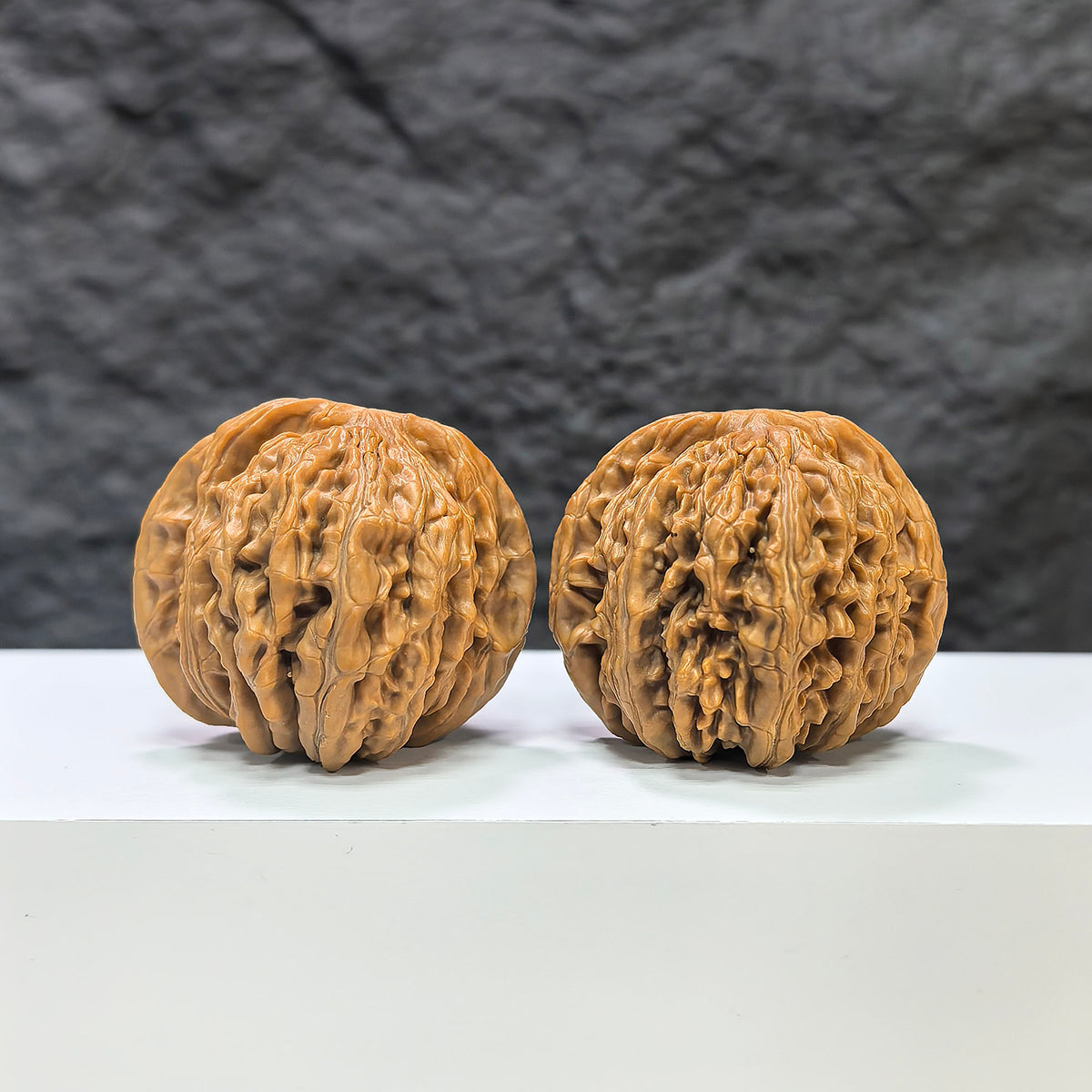 Pair of Sizuolou Wenwan Walnut carvings by Wenwan Art, 41mm x 39mm, featuring intricate traditional Chinese designs.