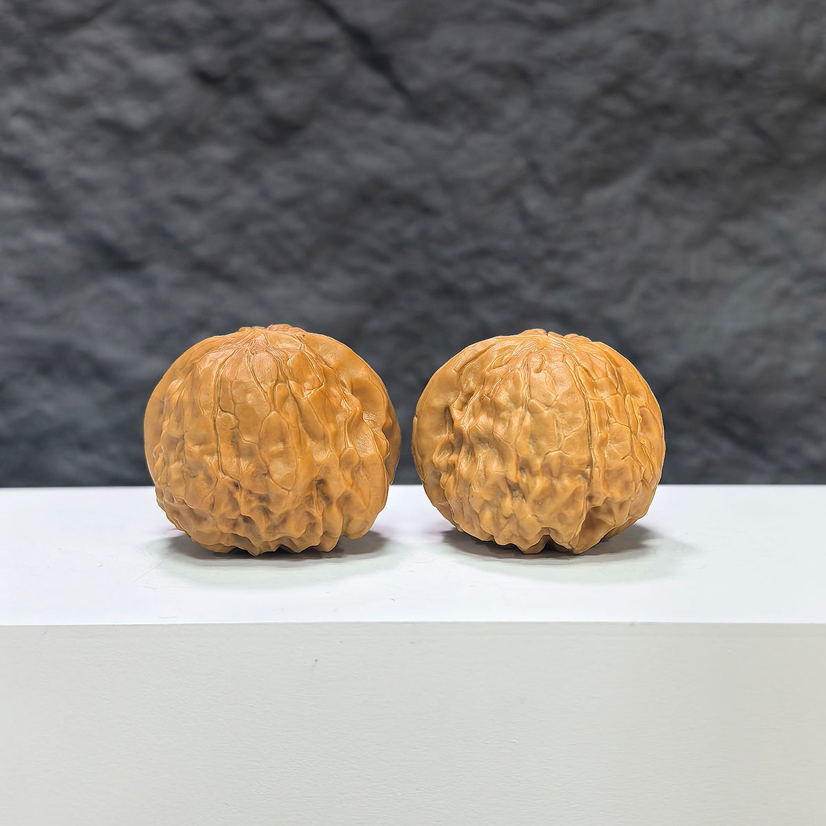 Wenwan Art Golden Toad Vessel and Heaven Devouring Beast Wenwan walnut pair, 36mm x 37mm, detailed carved traditional Chinese design.