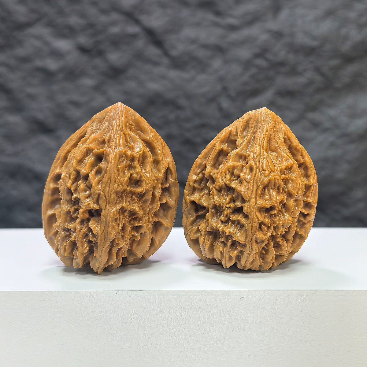 Pair of Beijing Chicken Heart Wenwan walnuts by Wenwan Art, 39mm, showing detailed natural walnut textures and warm brown tones.