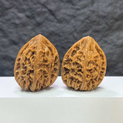 Pair of Beijing Chicken Heart Wenwan walnuts by Wenwan Art, 39mm, showing detailed natural walnut textures and warm brown tones.
