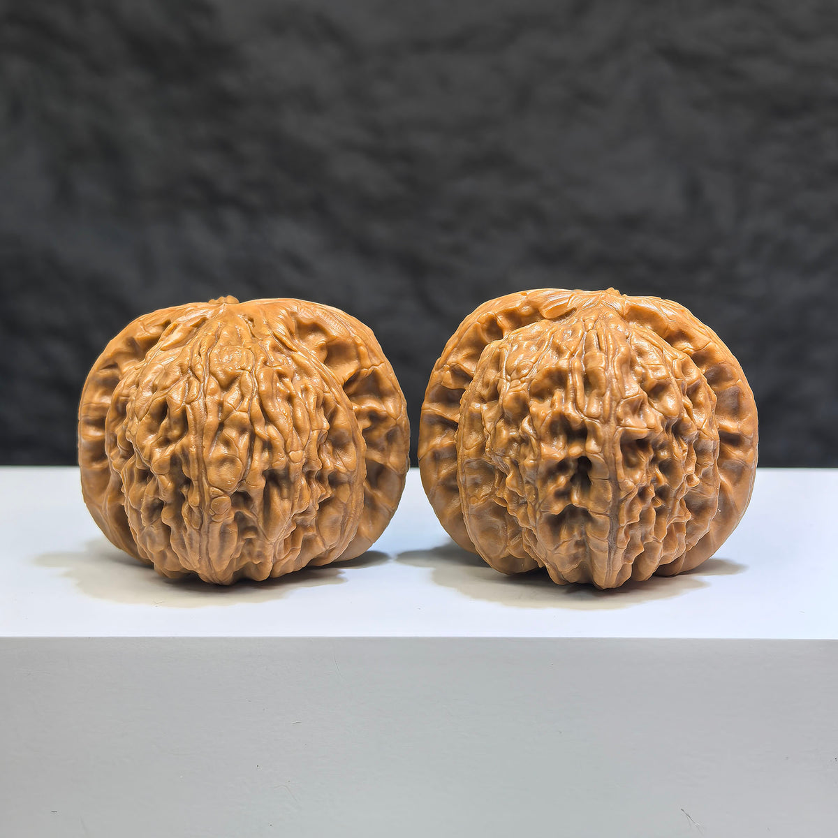 Pair of spherical white lion Wenwan walnuts from Wenwan Art, round-profile, 44mm by 43mm, showcasing smooth white walnut carvings.