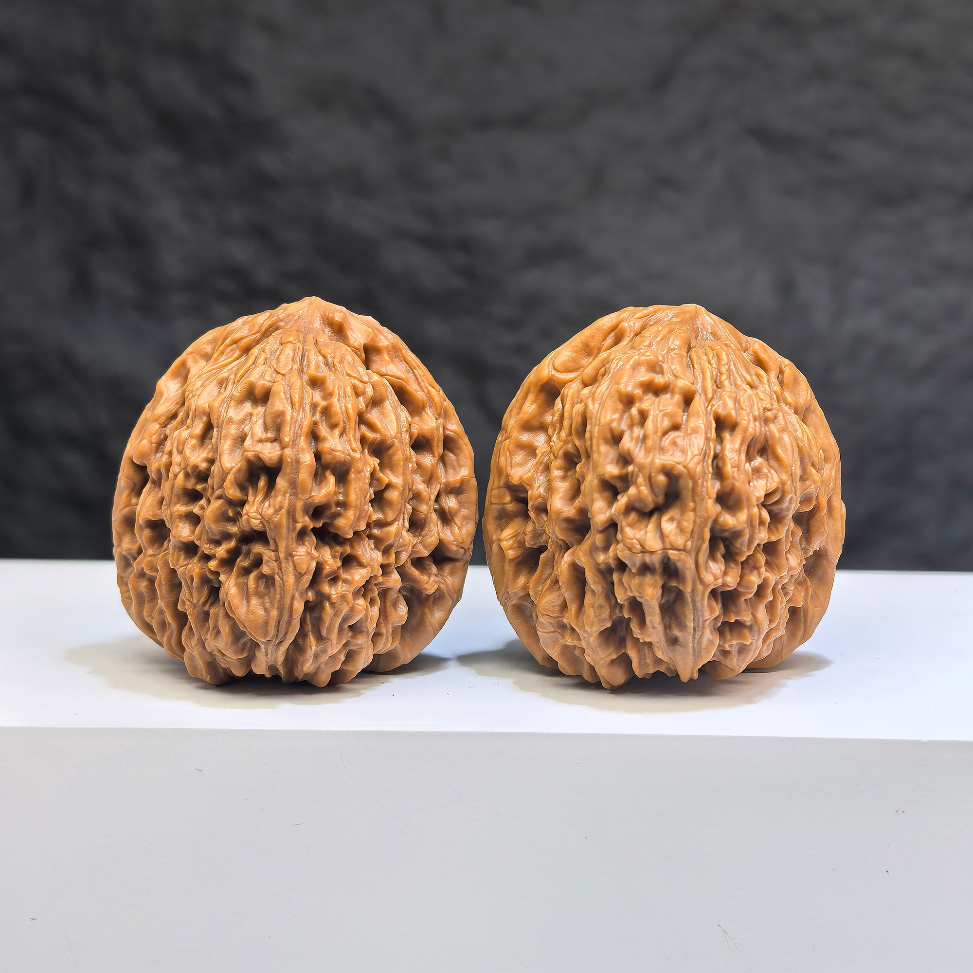 Pair of Nanjiangstone Wenwan walnuts from Wenwan Art, 38mm diameter, showcasing smooth, polished walnut carvings with intricate details.