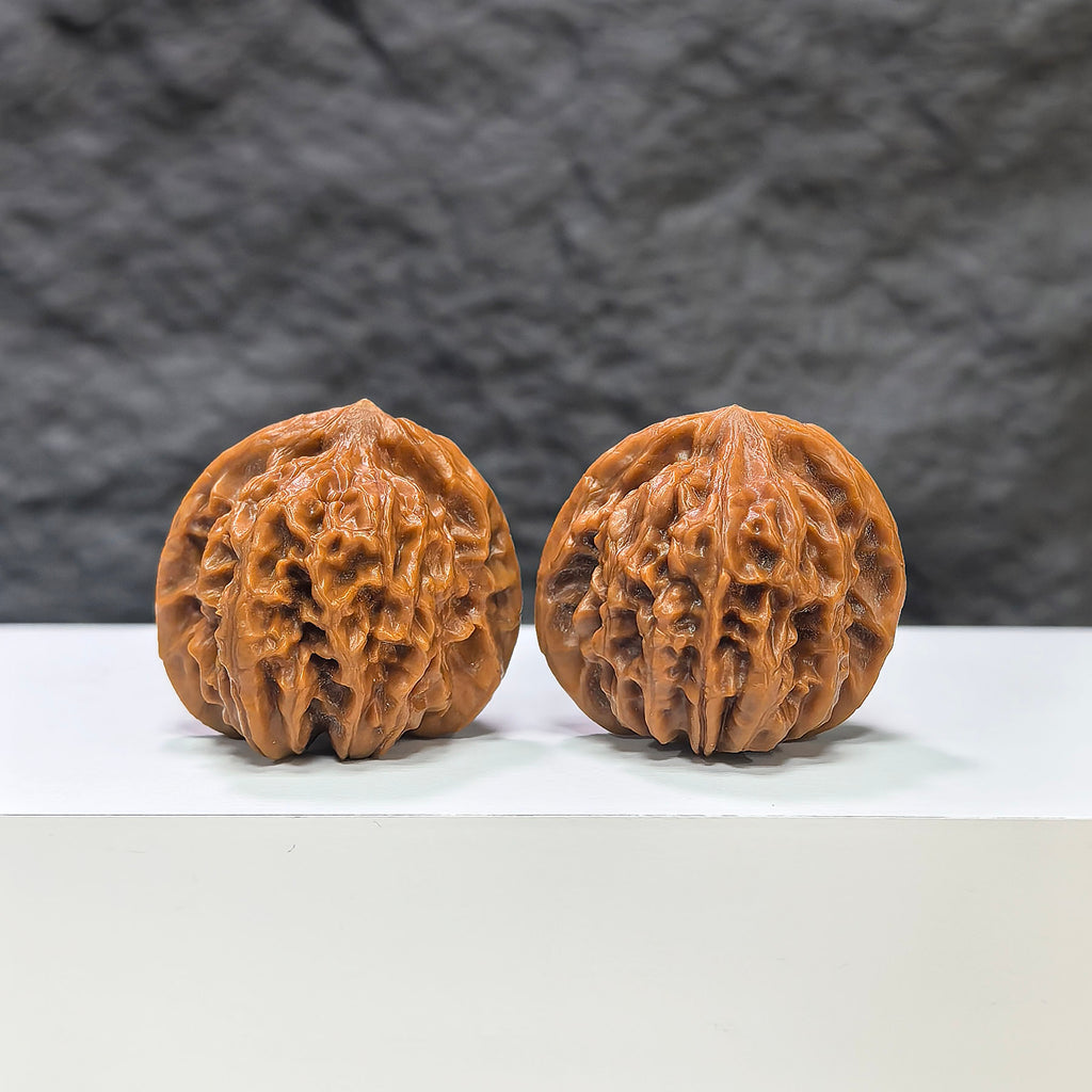 Pair of Pocket Sizuolou Wenwan walnuts by Wenwan Art, miniature 33mm size, showcasing detailed carved walnut art.