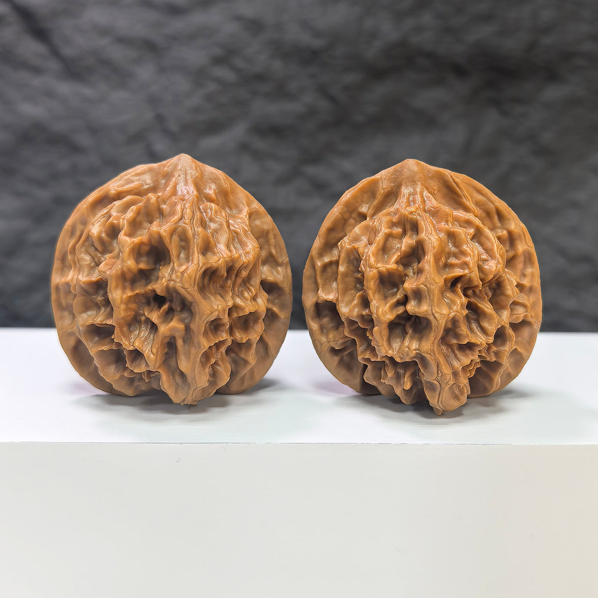 Pair of Emperor Wenwan Walnuts from Wenwan Art, 43mm and 42mm, showcasing intricate natural walnut patterns and smooth polished surfaces.