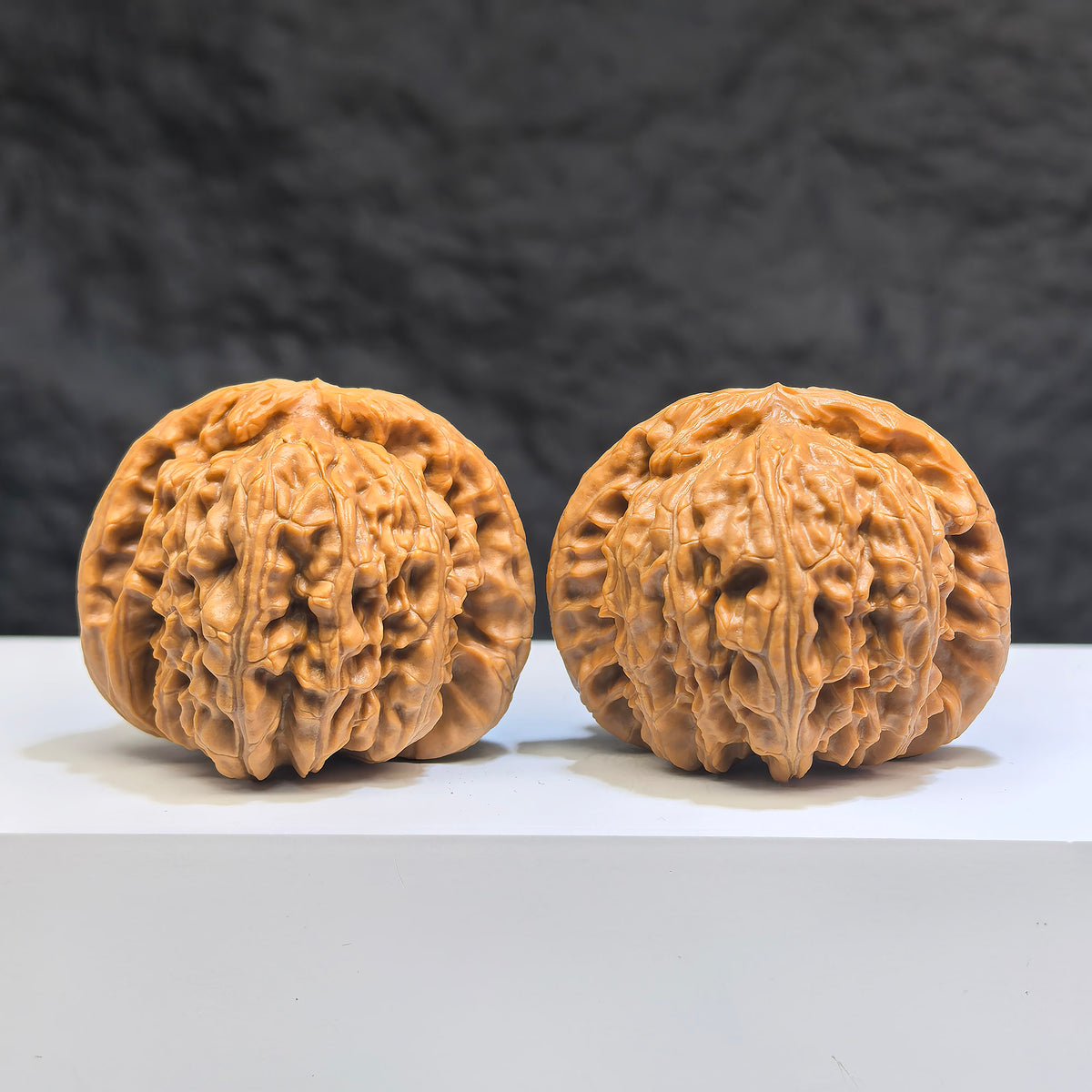 Pair of White Lion Wenwan Walnuts by Wenwan Art, featuring detailed white lion carvings, measuring 41mm and 38mm.