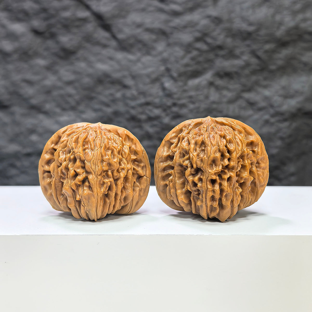 Pair of Sizuolou Wenwan walnuts from Wenwan Art, 41mm x 37mm, featuring intricate natural wood grain patterns.