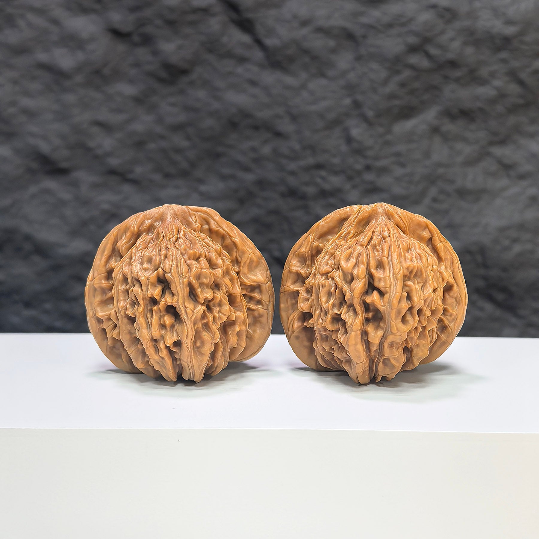 Pair of Sizuolou Classic Wenwan walnuts by Wenwan Art, 41mm x 42mm, showcasing smooth, polished walnut carvings.