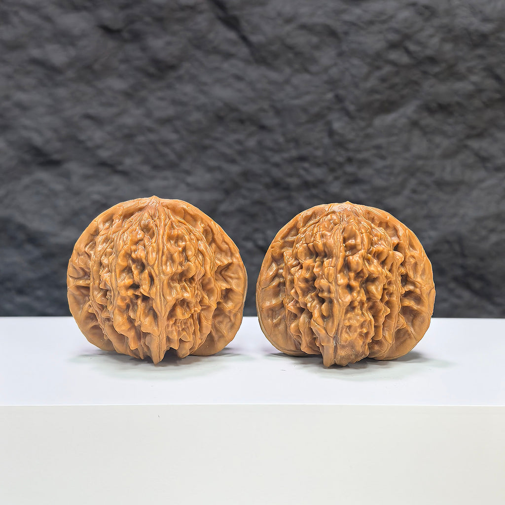 Selected grade Wenwan walnut from Wenwan Art, measuring 4.1x3.7cm, showcasing smooth, polished natural wood with intricate grain details.