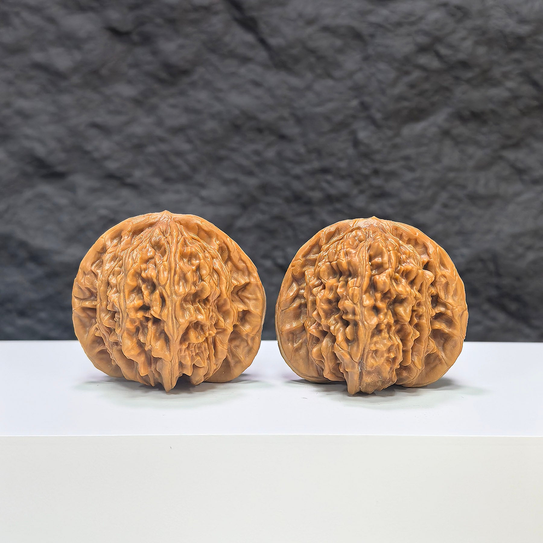 Selected grade Wenwan walnut from Wenwan Art, measuring 4.1x3.7cm, showcasing smooth, polished natural wood with intricate grain details.