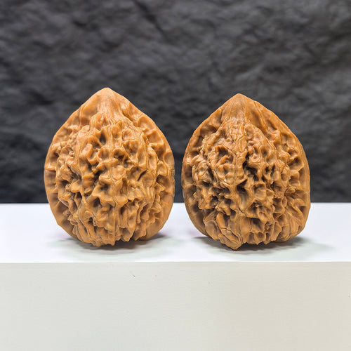 Pair of Classic Scholar Wenwan Walnuts by Wenwan Art, featuring 麒麟紋 pattern, 43mm and 40mm size, hand-matched for collectors.