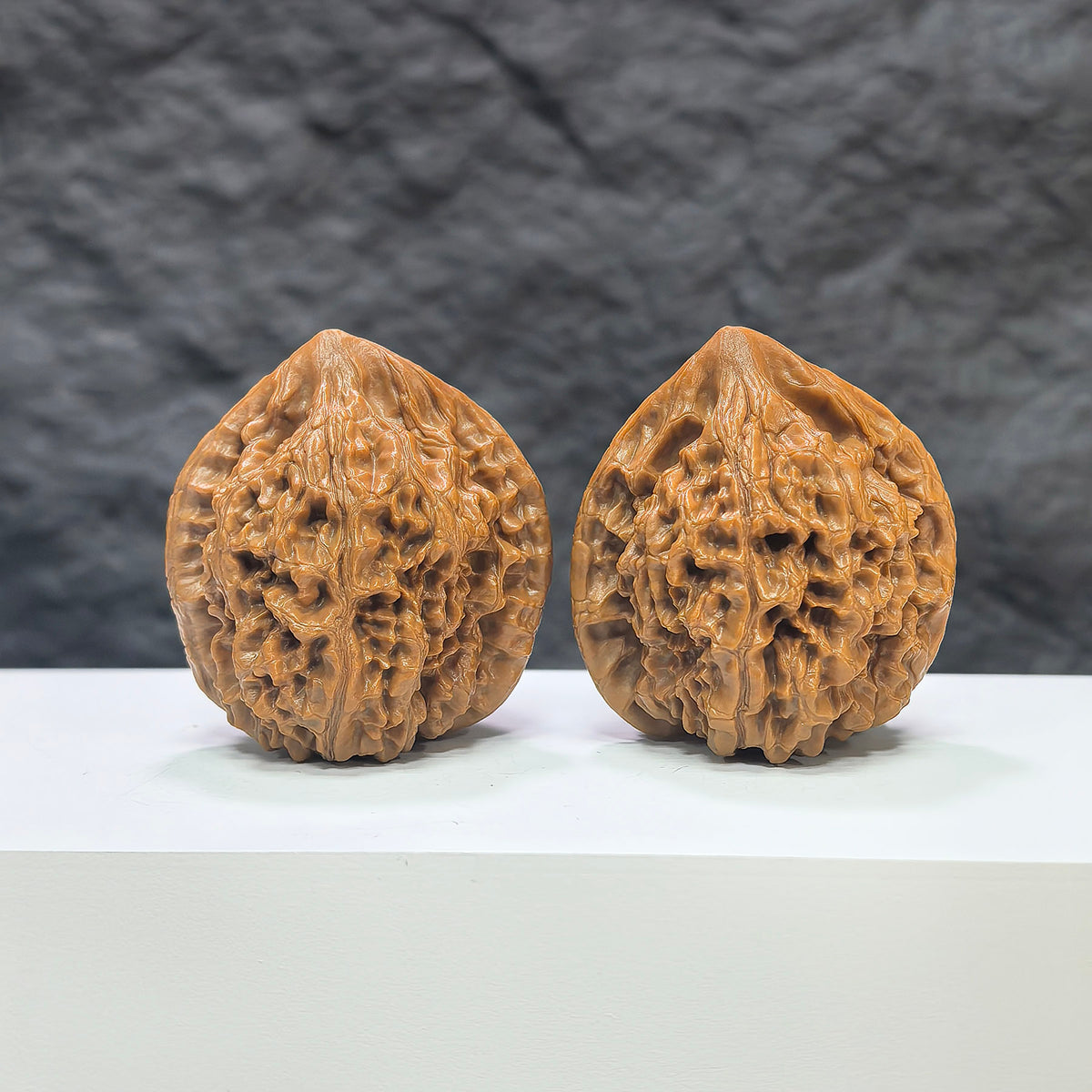 Pair of large Wenwan Art official Wenwan walnuts, 40mm, with smooth, polished walnut shells and natural wood texture.
