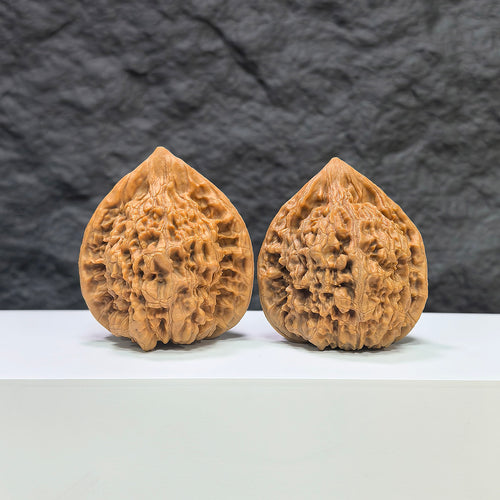 Pair of Wenwan Art Concave Base Peach Heart Official Hats, deep-base Wenwan walnuts with 43mm by 40mm size, natural wood appearance.