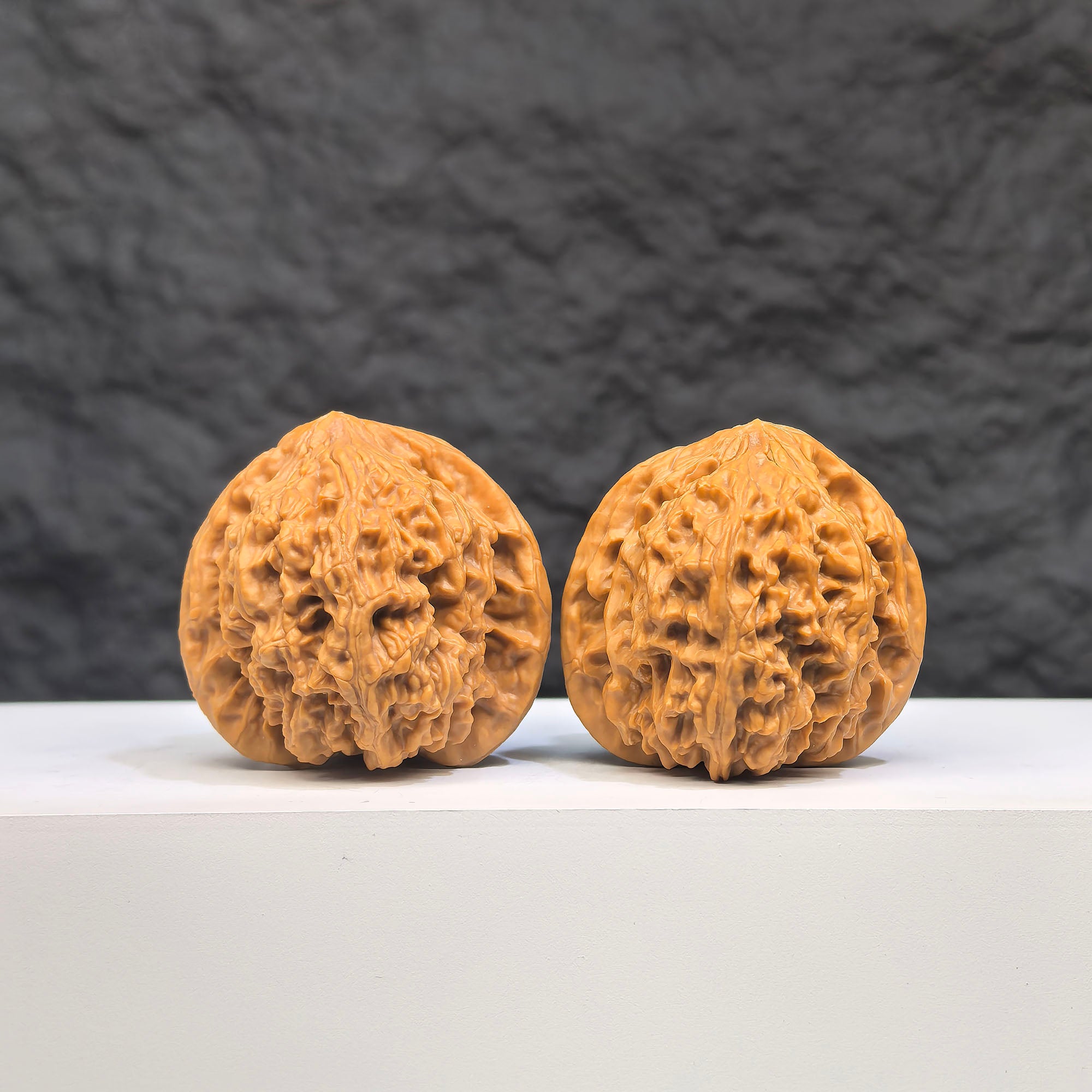 Pair of spherical full stars Wenwan walnuts with round profile, 38mm diameter, from Wenwan Art, showcasing intricate natural walnut patterns.