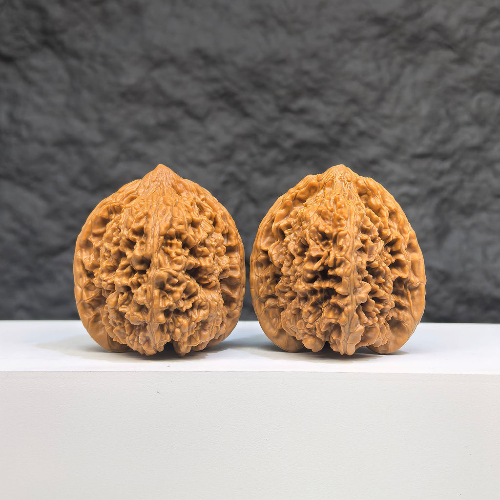 Pair of Wenwan Art Peach Heart Concave Base Full Stars Wenwan walnuts, 40mm x 42mm, with deep base and star patterns.