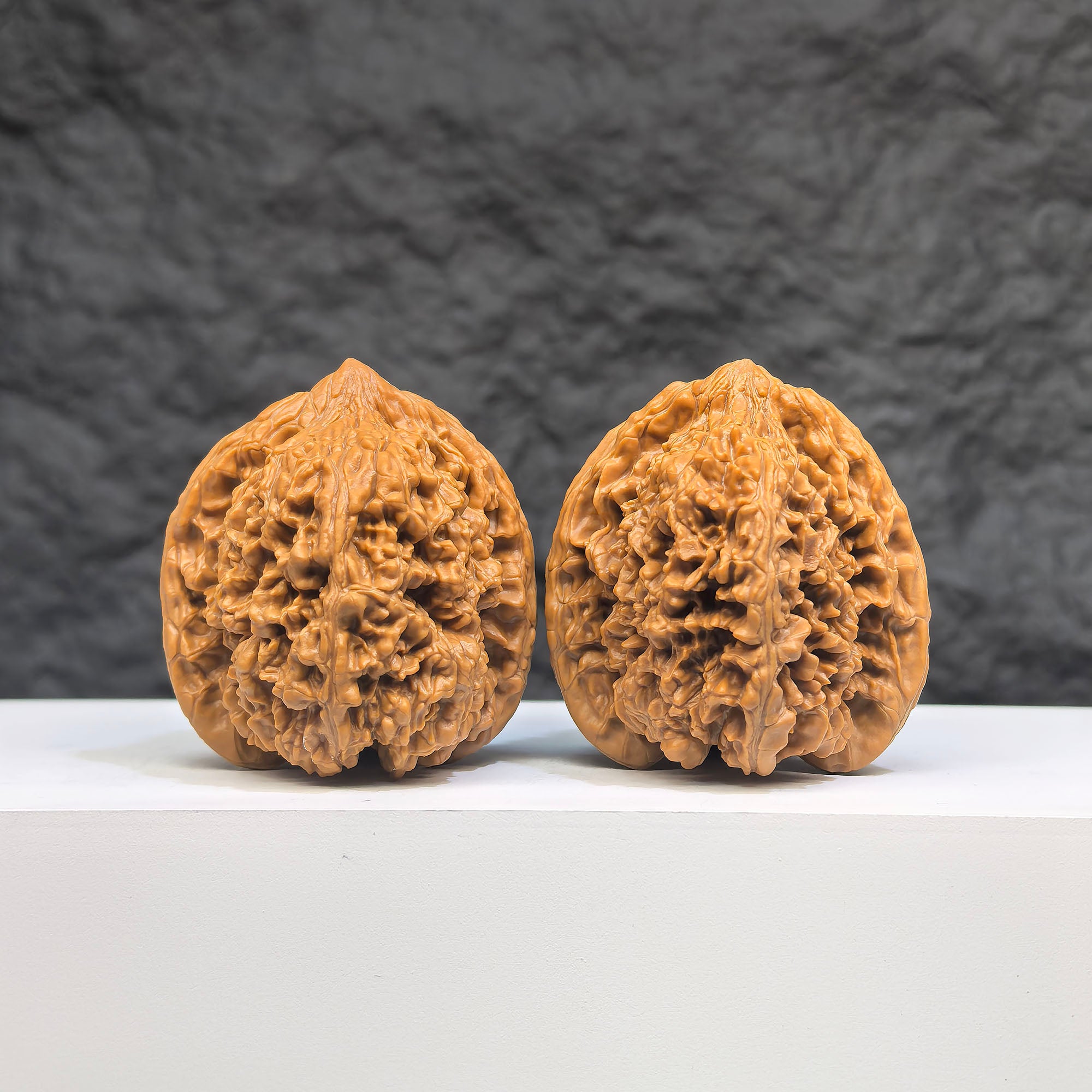Pair of Wenwan Art Peach Heart Concave Base Full Stars Wenwan walnuts, 40mm x 42mm, with deep base and star patterns.